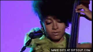 Bass player Esperanza Spalding playing rhythmically by accentuating and articulating specific notes